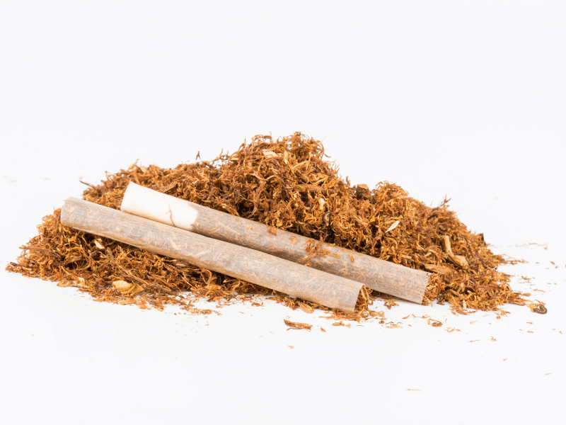 Premium flue cured Virginia tobacco leaves with golden color and export quality grading.